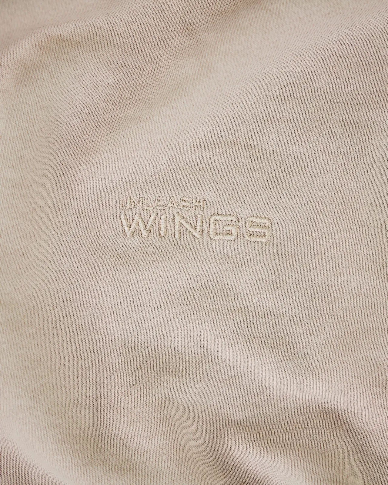 Damskie spodnie dresowe oversize UNLEASH WINGS BEIGE - Image 7